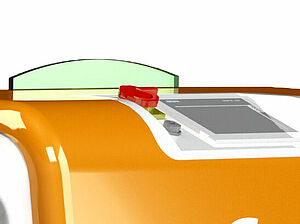Zoom auf die Oberseite eines orangen Kastens. An der abgerundeten oberen Kante, ist eine weiße Fläche. In dieser Fläche ist ein kleiner Bildschirm und links daneben ein roter Knopf eingelassen.